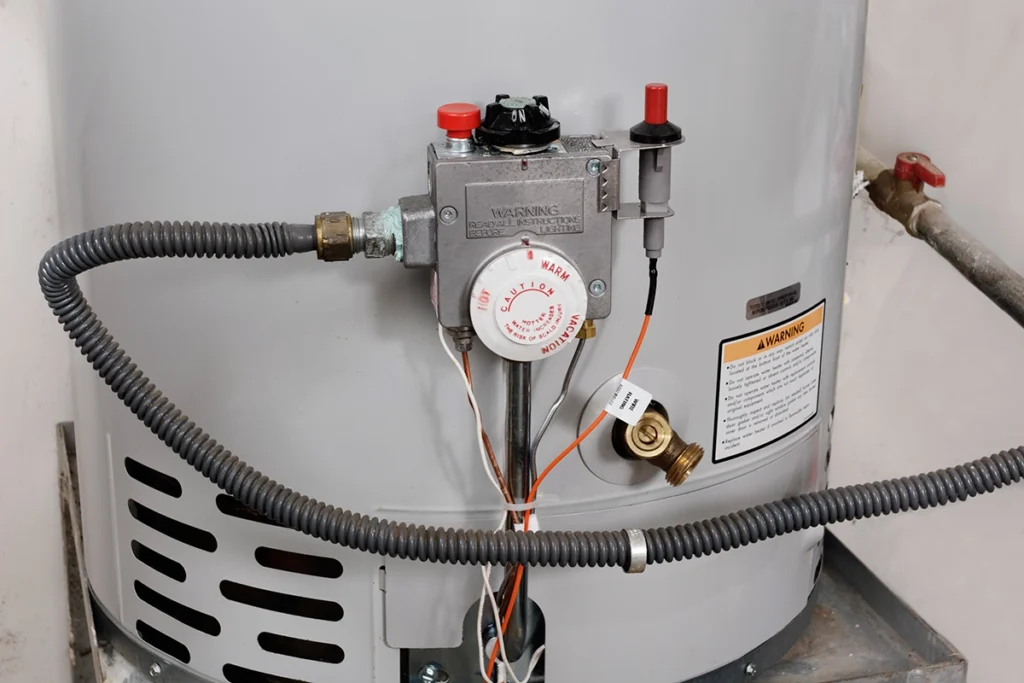 How long does it take a water heater to heat up? Gas water heater thermostat and control valve showing heating temperature adjustment
