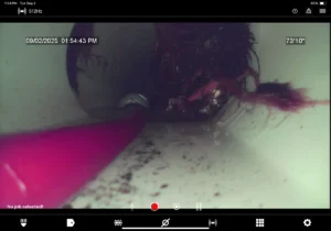 Sewer camera inspection showing roots blocking a drain line in Spotsylvania, VA — Clog Heroes Plumbing, Sewer & Drain.