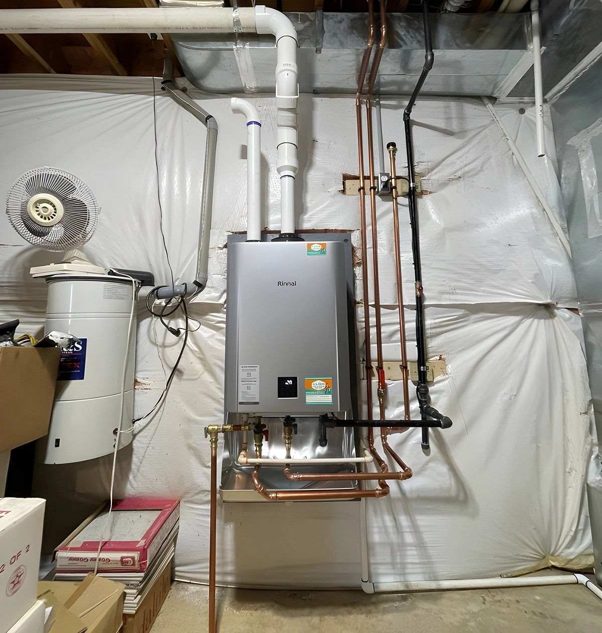 Tankless water heater pros and cons: Rinnai unit installed in home utility area