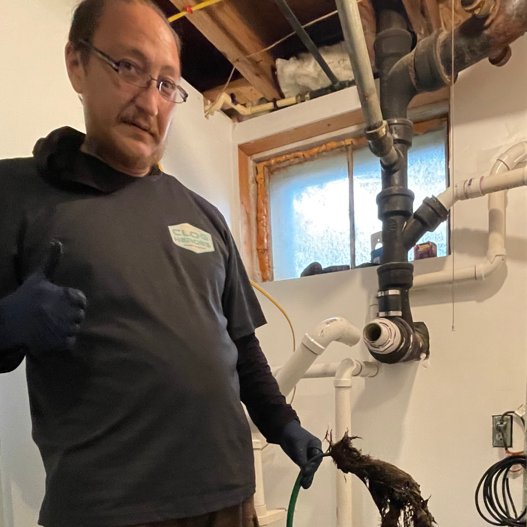 Plumbing Services In Fredericksburg VA - Clog Heroes image of clog heroes plumber fixing plumbing issue in Fredericksburg VA